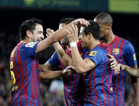 Barcelona's  Xavi, Cesc and Abidal celebrate Alexis Sanchez's goal against Levante UD during Spanish first division soccer match at Nou Camp stadium in Barcelona