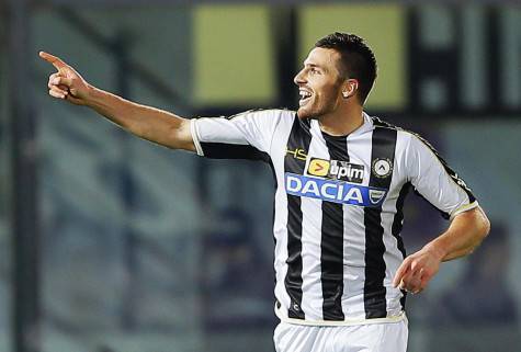 Udinese's Thomas Heurtaux, of France, celebrates after scoring his side's second goal during a Serie A soccer match between Livorno and Udinese, in Leghorn, Italy, Saturday, Dec. 21, 2013. (AP Photo/Francesco Speranza )
