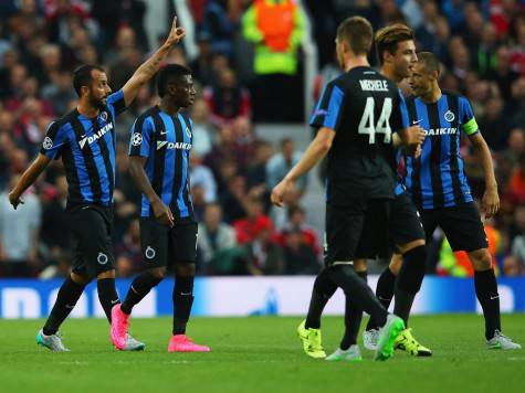 MANCHESTER, ENGLAND - AUGUST 18: Victor Vazquez (L) of Club Brugge celebrates the own goal scored by Michael Carrick of Manchester United during the UEFA Champions League Qualifying Round Play Off First Leg match between Manchester United and Club Brugge at Old Trafford on August 18, 2015 in Manchester, England. (Photo by Alex Livesey/Getty Images)
