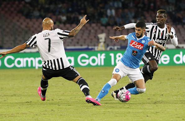 Napoli's Albanian defender Elseid Hysaj (C) vies with Juventus' French midfielder Paul Pogba (R) and Juventus' French forward Simone Zaza (L) during the Italian Serie A football match SSC Napoli vs FC Juventus on September 26, 2015 at the San Paolo stadium in Naples. AFP PHOTO / CARLO HERMANN (Photo credit should read CARLO HERMANN/AFP/Getty Images)