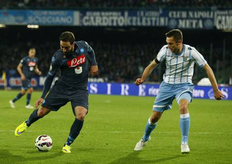 Napoli's forward from Argentina Gonzalo Higuain (L) fights for the ball with Lazio's defender from Netherlands Stefan de Vrij during the Italian Tim Cup semifinal second leg football match SSC Napoli vs SS Lazio on April 8, 2015 at the San Paolo stadium in Naples. AFP PHOTO / CARLO HERMANN        (Photo credit should read CARLO HERMANN,CARLO HERMANN/AFP/Getty Images)