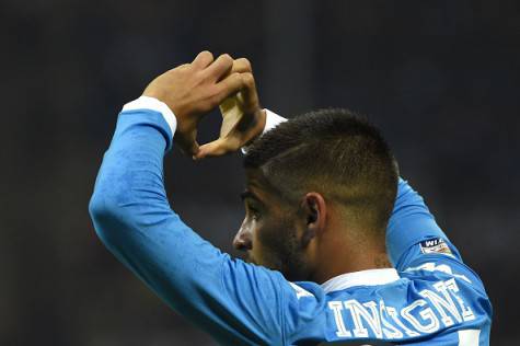 Napoli's Italian midfielder Lorenzo Insigne celebrates after scoring during the Italian Serie A football match between AC Milan and Napoli at San Siro Stadium in Milan on October 4,  2015. AFP PHOTO / OLIVIER MORIN        (Photo credit should read OLIVIER MORIN/AFP/Getty Images)