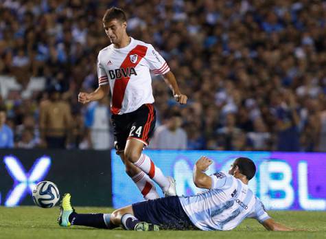 BUENOS AIRES, ARGENTINA - NOVEMBER 23:  Emanuel Mammana of River Plate fights for the ball with Luciano Aued of Racing Club during a match between Racing Club and River Plate as part of 17th round of Torneo de Transicion 2014 at Presidente Peron Stadium on November 23, 2014 in Buenos Aires, Argentina. (Photo by Gabriel Rossi/LatinContent/Getty Images)