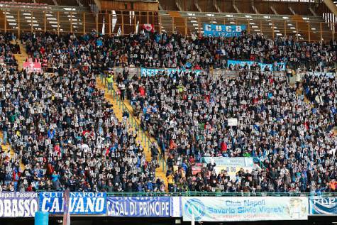 People hold flyers depicting the face of Napoli's French defender Kalidou Koulibaly before the Italian Serie A football match SSC Napoli vs Carpi FC on February 7, 2016 at the San Paolo stadium in Naples, in solidarity with the player victim of racists slogans from Lazio's fans during the football match SS Lazio vs SSC Napoli on February 3. / AFP / CARLO HERMANN        (Photo credit should read CARLO HERMANN/AFP/Getty Images)